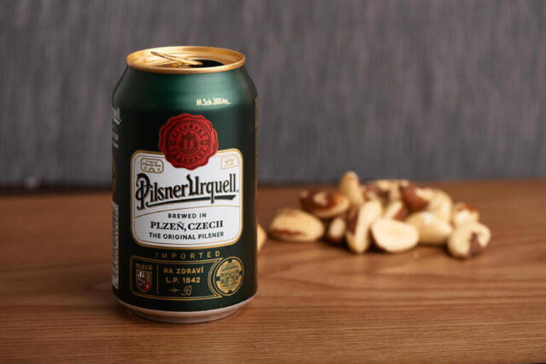 Pilsner Urquell can. Pilsner Urquell is a Czech lager brewed by the Pilsner Urquell Brewery and the world's first bl Pilsner Urquell can. Pilsner Urquell is a Czech lager brewed by the Pilsner Urquell Brewery and the world's first bl