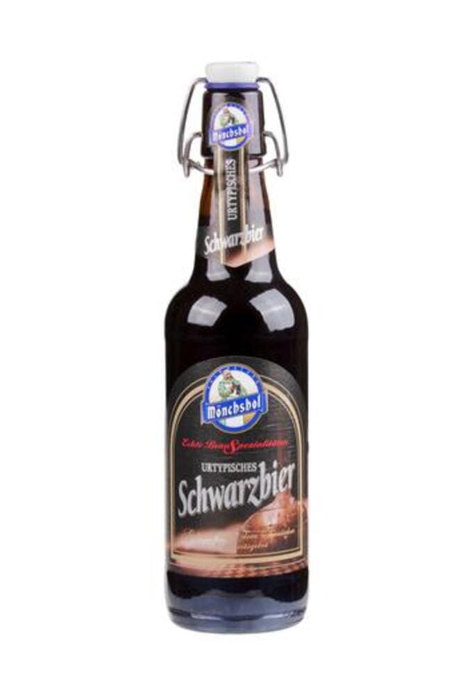 A bottle of Monchshof Schwarzbier. A dark beer imported from Kulmbach Germany, isolated on white background A bottle of Monchshof Schwarzbier. A dark beer imported from Kulmbach Germany, isolated on white background