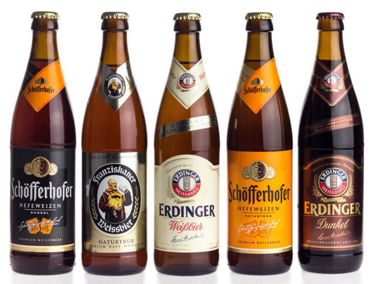 Collection of German Schofferhofer, Franziskaner and Erdinger wheat beers isolated on a white background Collection of German Schofferhofer, Franziskaner and Erdinger wheat beers isolated on a white background