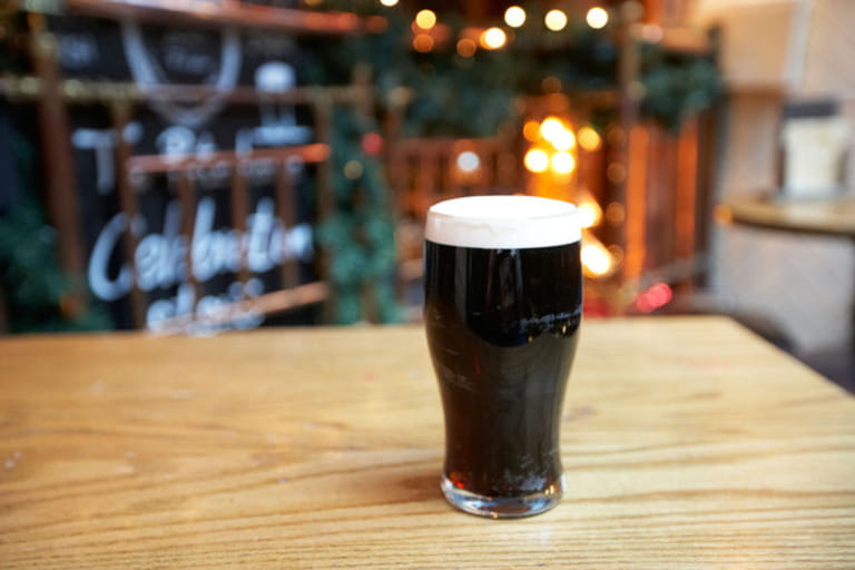 pint of stout on a table in a gastro pub london england united kingdom uk pint of stout on a table in a gastro pub london england united kingdom uk