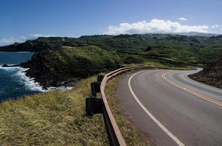 Maui Scenic Highway: The Honoapiilani Highway passes beside a rocky coastline and curves into the mountains at the northwest end of Maui. Maui Scenic Highway: The Honoapiilani Highway passes beside a rocky coastline and curves into the mountains at the northwest end of Maui.