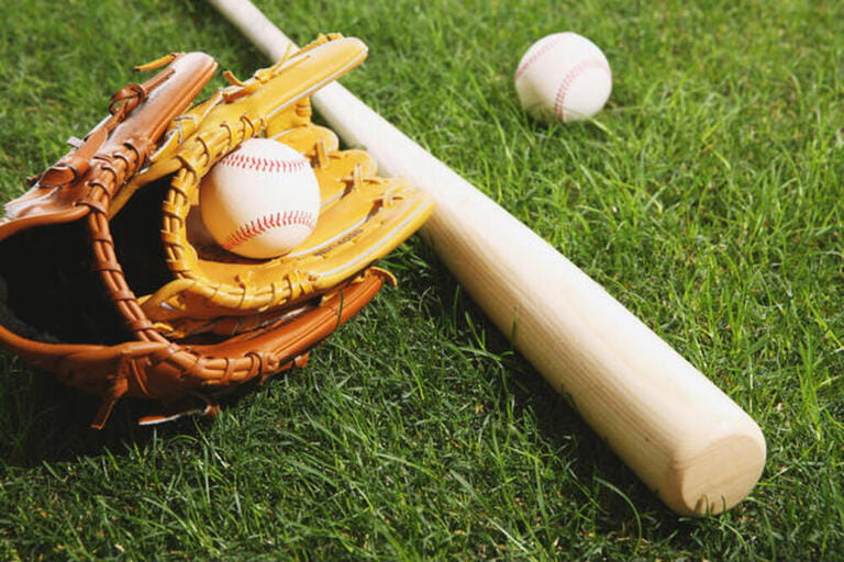 Baseball equipment on grass Baseball equipment on grass