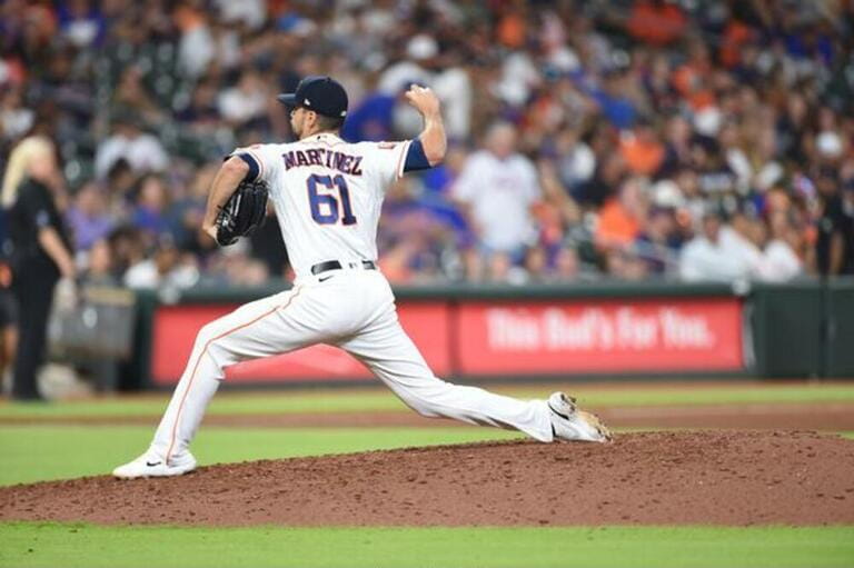 Houston Astros relief pitcher Seth Martinez (61) in the bottom of the seventh inning of the MLB game between the Houston Astros and the New York Mets Houston Astros relief pitcher Seth Martinez (61) in the bottom of the seventh inning of the MLB game between the Houston Astros and the New York Mets