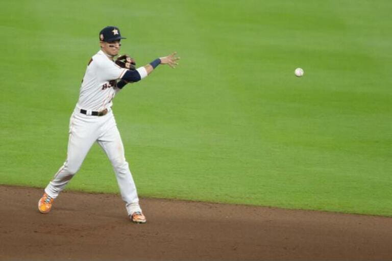 Houston Astros center fielder Mauricio Dubon (14) throws to second for the out in the eighth inning against the New York Mets. The Astros defeat the Houston Astros center fielder Mauricio Dubon (14) throws to second for the out in the eighth inning against the New York Mets. The Astros defeat the