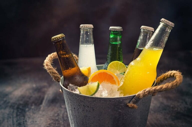 Cold Bottles of Various Drinks in The Ice Bucket Cold Bottles of Various Drinks in The Ice Bucket