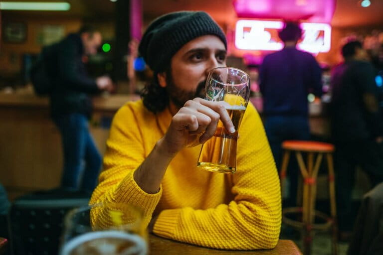 Man with glass of beer in a pub Man with glass of beer in a pub