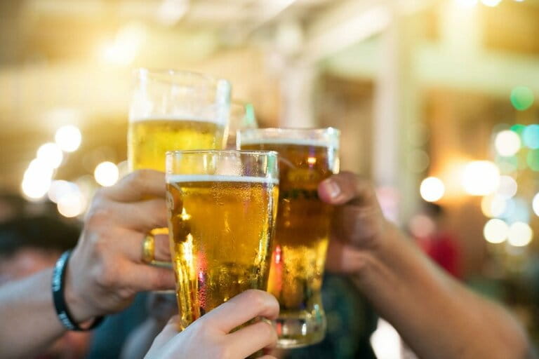 Group of happy friends drinking and toasting beer at brewery bar restaurant Group of happy friends drinking and toasting beer at brewery bar restaurant
