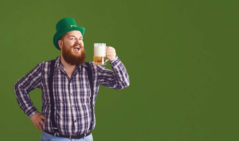 Happy St. Patrick's Day. The fat man in the blue hat kept his hand on the glass Happy St. Patrick's Day. The fat man in the blue hat kept his hand on the glass
