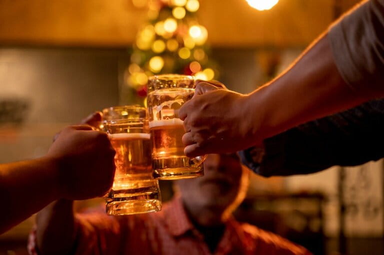 Happy Senior man clinking beer glasses in the brewery Happy Senior man clinking beer glasses in the brewery