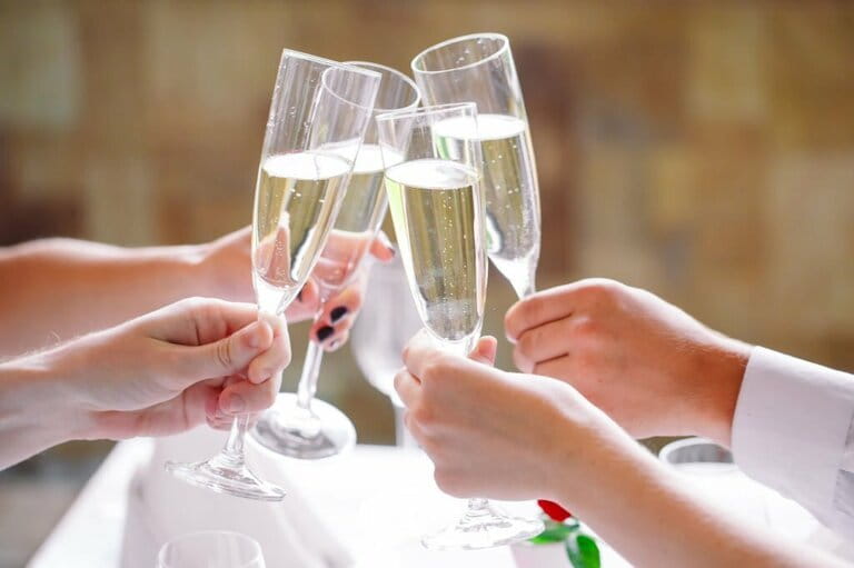 Friends in the restaurant have toast. Friends in the restaurant have toast.